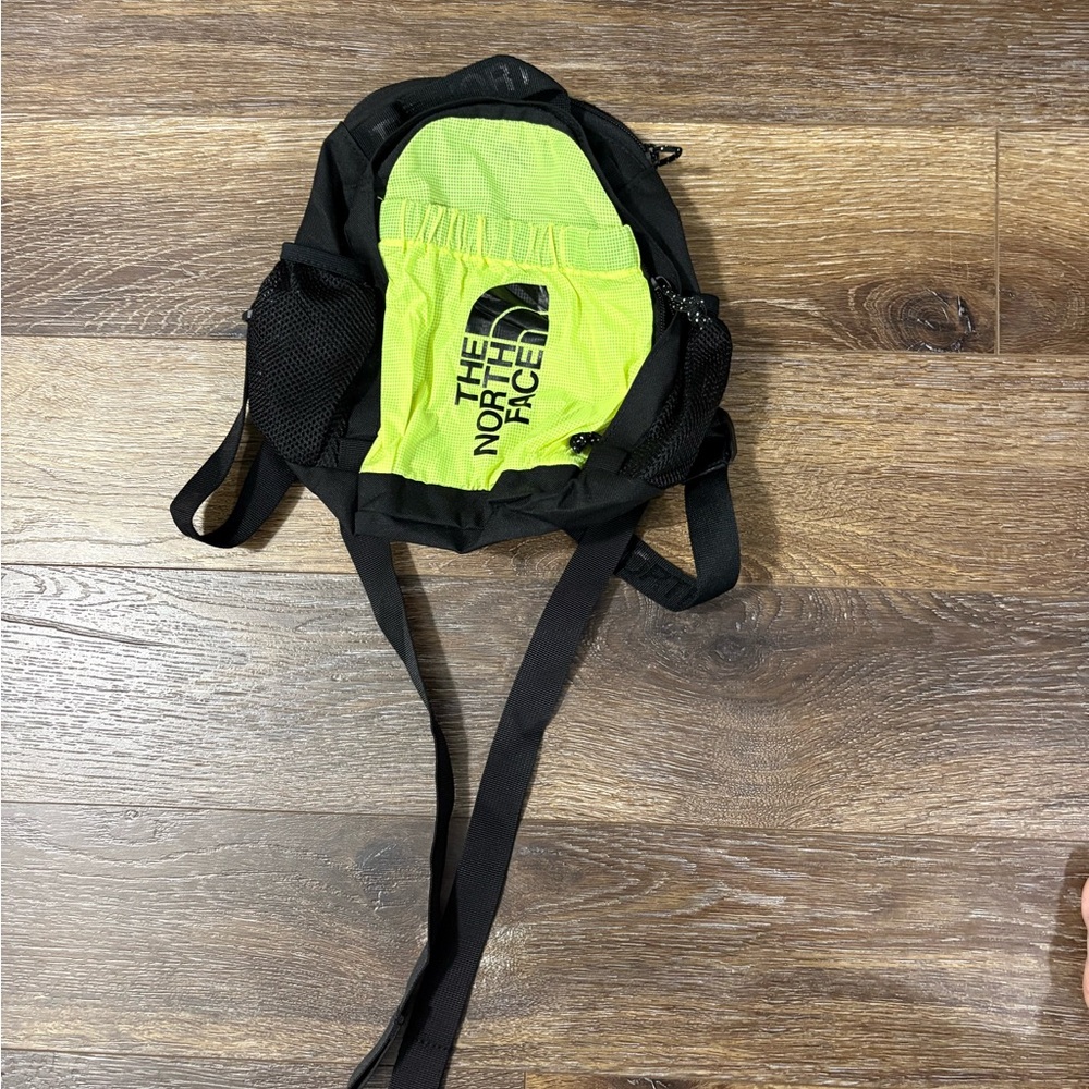 The North Face Black and Neon Green Mini Backpack